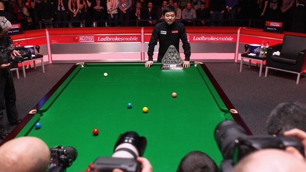 Ding Junhui poses for the cameras after his impressive 10-4 win at Wembley