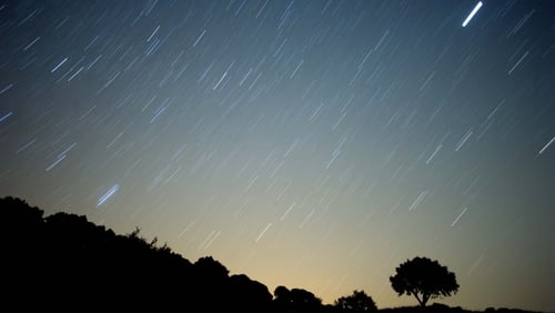 Astronomy - A meteor streaks across the sky during a meteorite shower in Spain