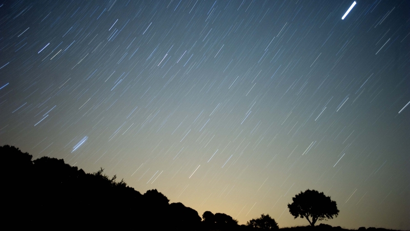 Astronomy - A meteor streaks across the sky during a meteorite shower in Spain
