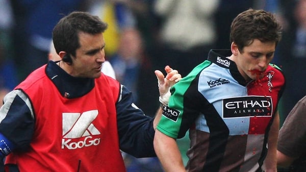Tom Williams leaves the field after faking a mouth injury