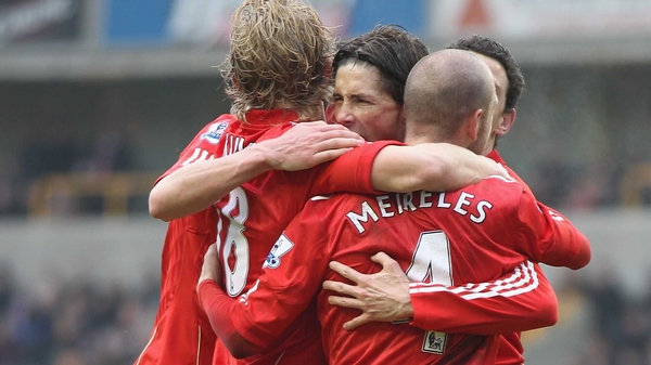 Torres is congratulated after netting Liverpool's opener