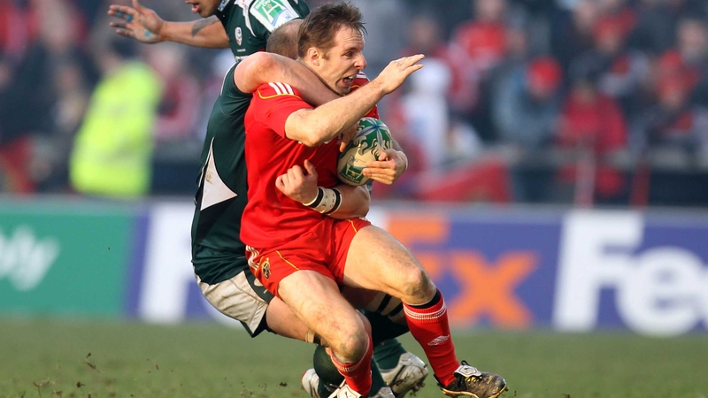Tomás O'Leary is tackled by Matt Garvey at Thomond Park