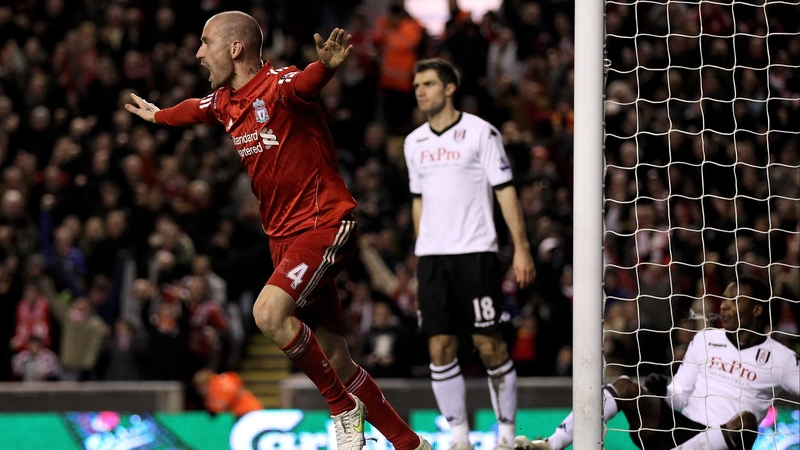 Raul Meireles wheels away after John Pantsil's (on ground) own goal