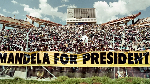 A crowd of 40,000 ANC supporters listen to the address of ANC President Nelson Mandela during a mass rally in Mmabatho in March 1994, ahead of the April general election