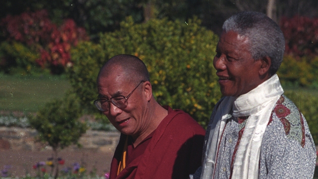 The Dalai Lama meets President Nelson Mandela at the South African parliament in Cape Town, in August 1996