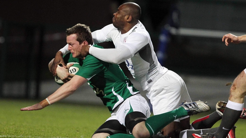 Denis Hurley drives through a challenge from England's Ugo Monye to open the score