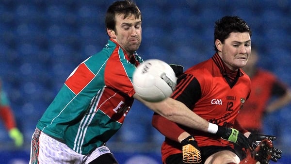Mayo's Ronan McGarrity and Down's Martin Clark in action in McHale Park