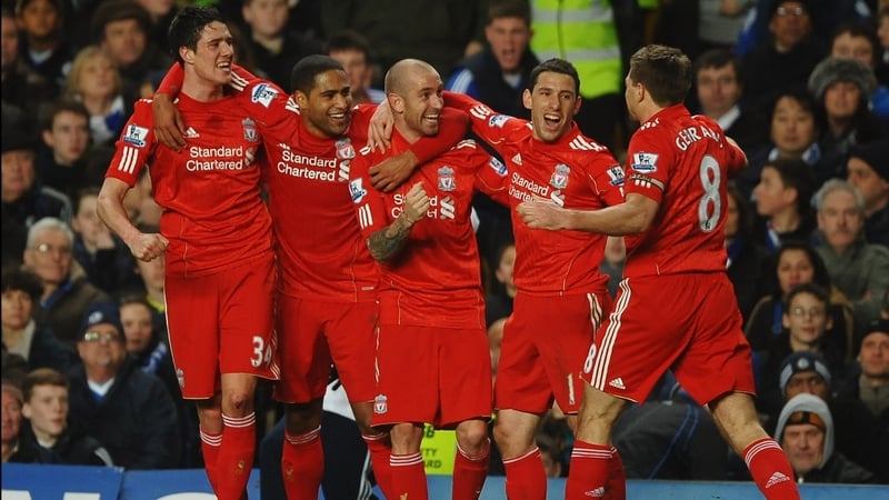 Raul Meireles and his Liverpool team-mates celebrate his winning goal at Stamford Bridge