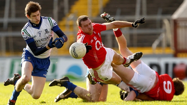 Pearse O'Neill of Cork being put under pressure by Monaghan's David Hughes