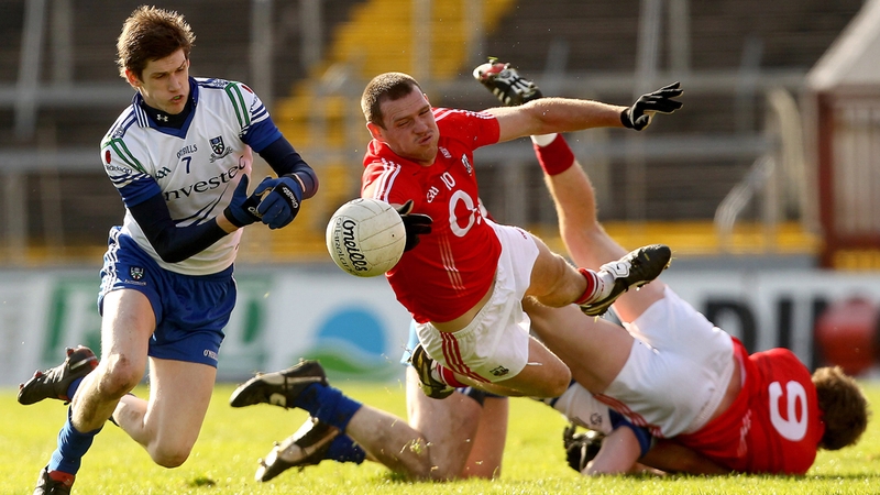 Pearse O'Neill of Cork being put under pressure by Monaghan's David Hughes