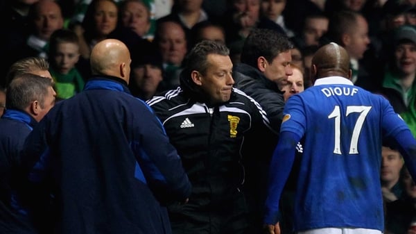 Neil Lennon and El Hadji Diouf clash after the Celtic v Rangers game