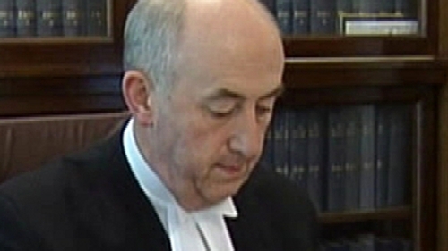 Mr Justice Peter Kelly says Patricia Quinn "negligent" over loan documents