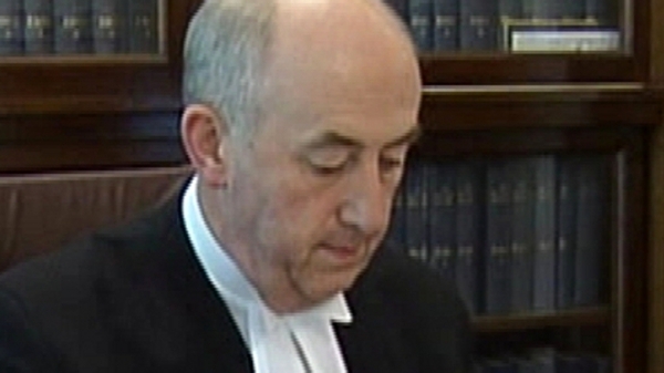 Mr Justice Peter Kelly says Patricia Quinn "negligent" over loan documents
