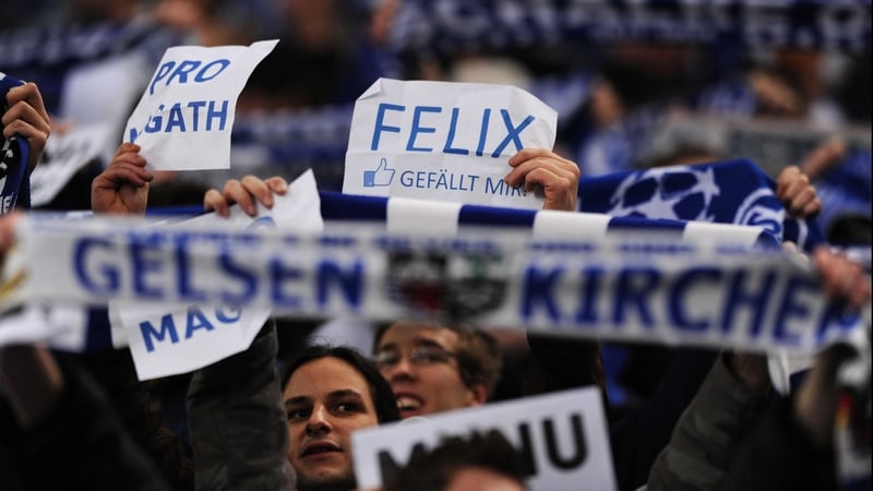 Schalke fans show their support for coach Felix Magath prior to their side's 3-1 victory over Valencia