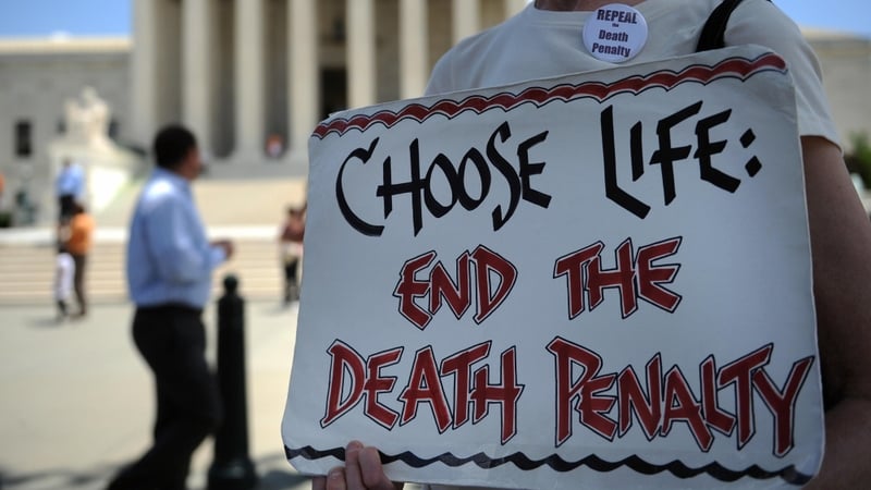 US - An anti-death penalty activist passes out pamphlets during a rally outside the US Supreme Court in 2009