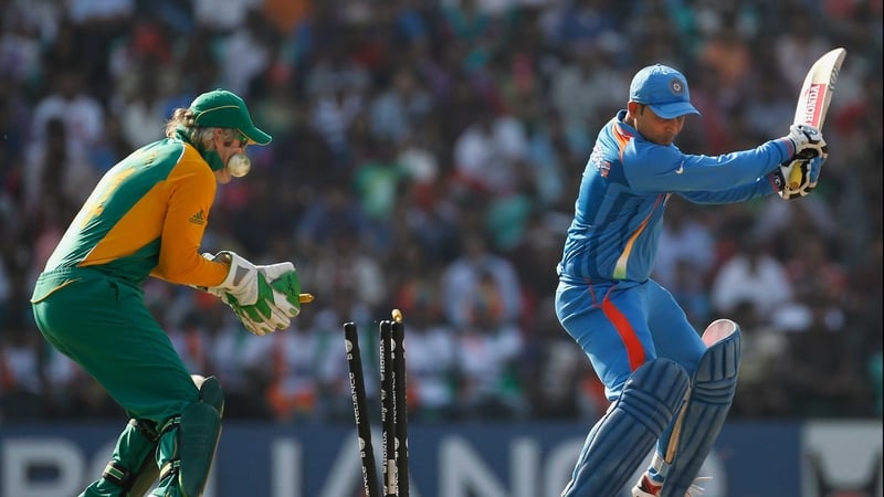 Virender Sehwag of India is bowled by Faf du Plessis of South Africa during the Group B ICC World Cup Cricket match between India and South Africa