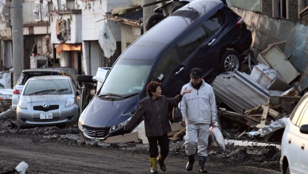 Japan disasters - Companies' profits slashed by one third