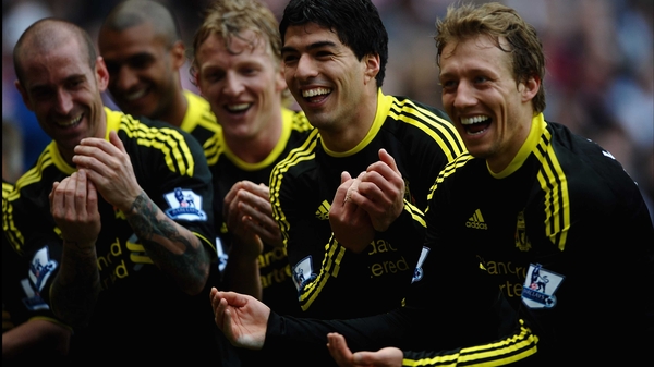 Liverpool's Luis Suarez of celebrates his goal with Lucas Leiva, Dirk Kuyt and Raul Meireles