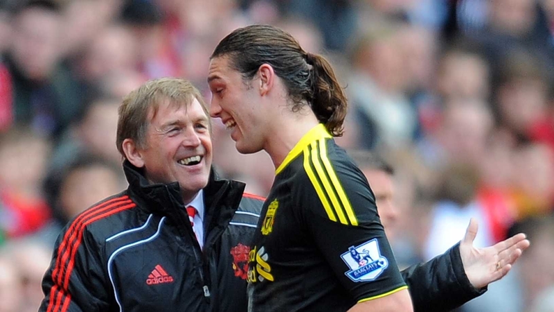 Kenny Dalglish shares a joke with new striker Andy Carroll as he is taken off during Sunday's victory