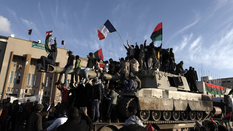 Rebels in Benghazi celebrate the intervention of French military jets
