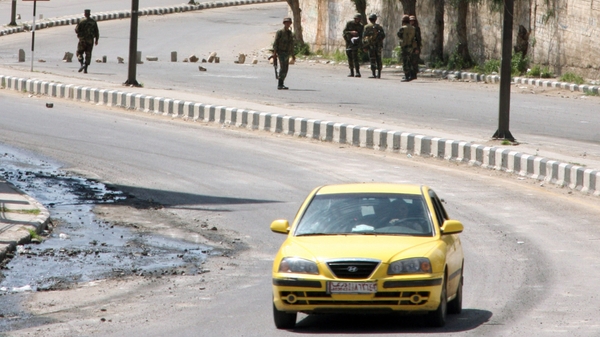 Syria - Security forces man a checkpoint outside Daraa