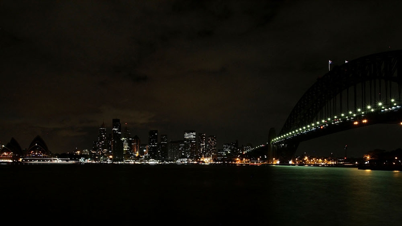 Australia - Lights are turned off on Sydney Harbour Bridge