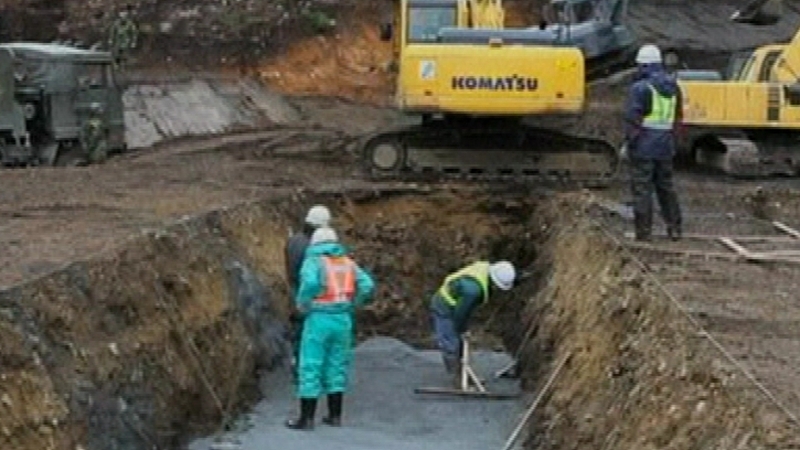 Mass graves - Are being dug for the dead