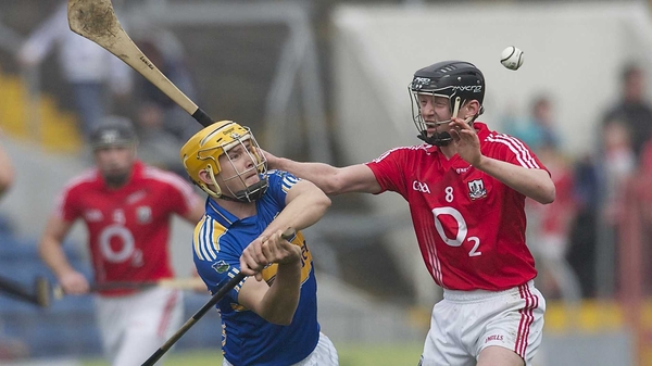 Cork's Lorcan McLoughlin hassles Tipperary's David Young