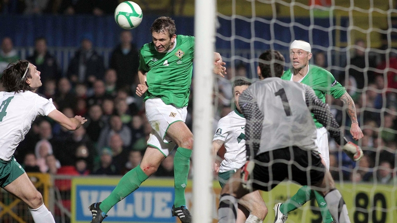 Northern Ireland's Gareth McAuley heads past goalkeeper Samir Handanovic only for his shot to be cleared off the line