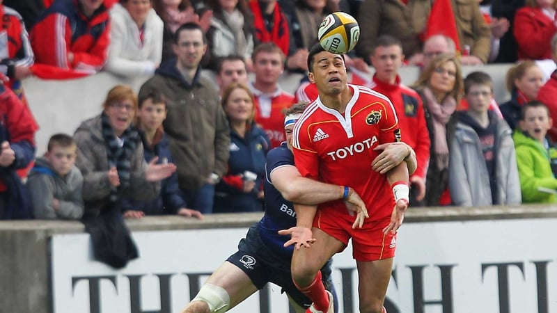 Munster's Lifeimi Mafi is tackled by Leinster's Jamie Heaslip
