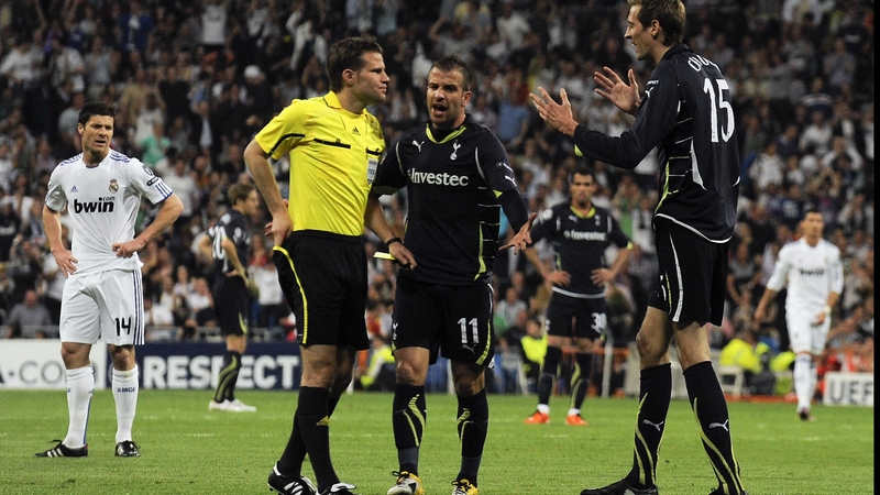 Spurs' Peter Crouch protests his innocence after being dismissed by referee Felix Brych