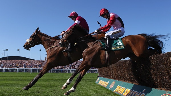 Over the last - Quito De La Roque, ridden by Davy Russell, jumps the last fence ahead of Sarando