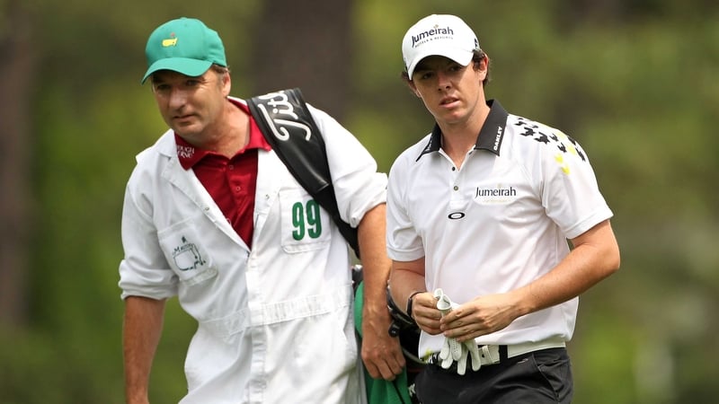 Rory McIlroy - seen here with his caddie JP Fitzgerald - has revealed Graeme McDowell has been in touch to say 'I love you'