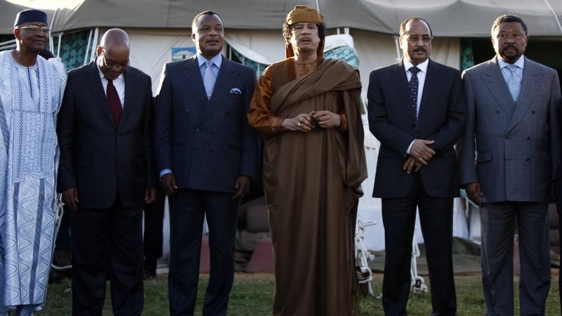 Presidents Amadou Toumani Toure of Mali, Jacob Zuma of South Africa, Denis Sassou Nguesso of Congo, Libyan leader Muammar Gaddafi, Mohamed Ould Abdel Aziz of Mauritania and African Union president Jean Ping stand outside a tent erected at Gaddafi's Bab al