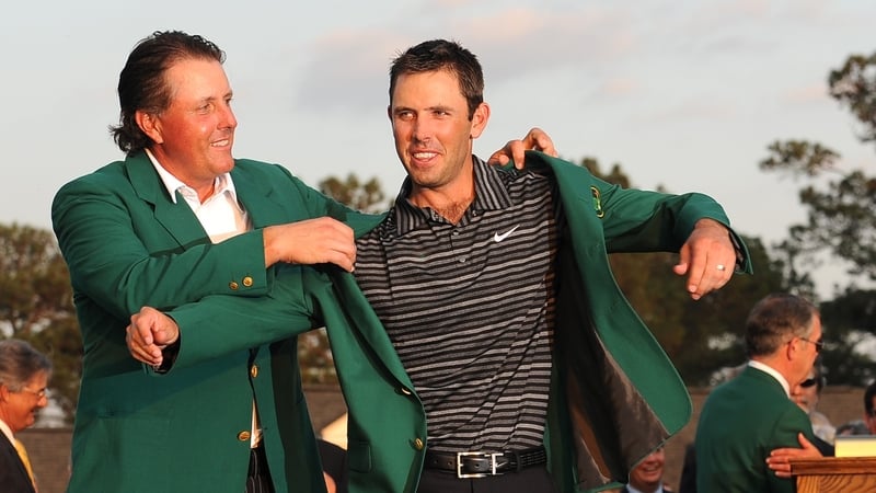 Green jacket - Phil Mickleson helps Charl Schwartzel don the famous jacket
