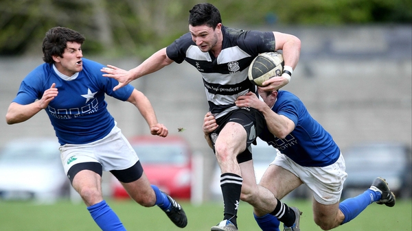 Final for Donnybrook - St Mary's Ian McKinley and Gavin Dunne attempt to tackle David Mongon of Old Belvedere