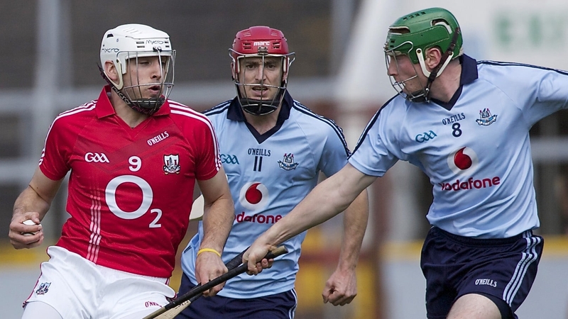 Cork's Pa Cronin and John McCaffrey of Dublin battle for possession