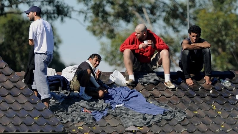 Sydney - Protestors climbed on to the roof of detention centre