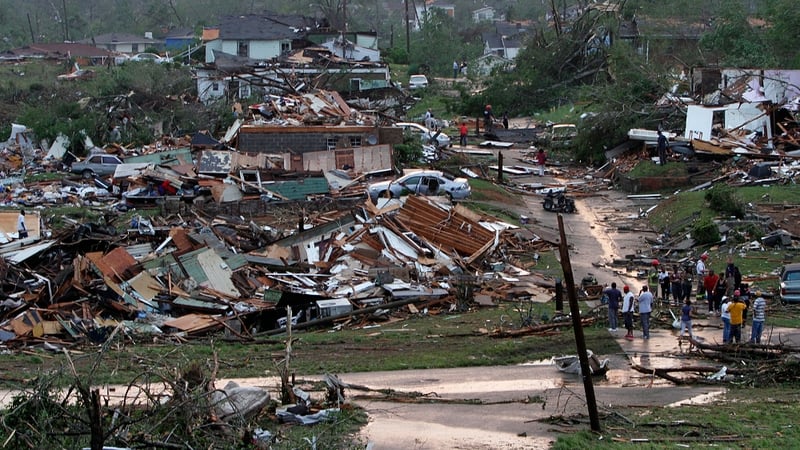 Residents survey area hit by a tornado in Pratt City, Alabama