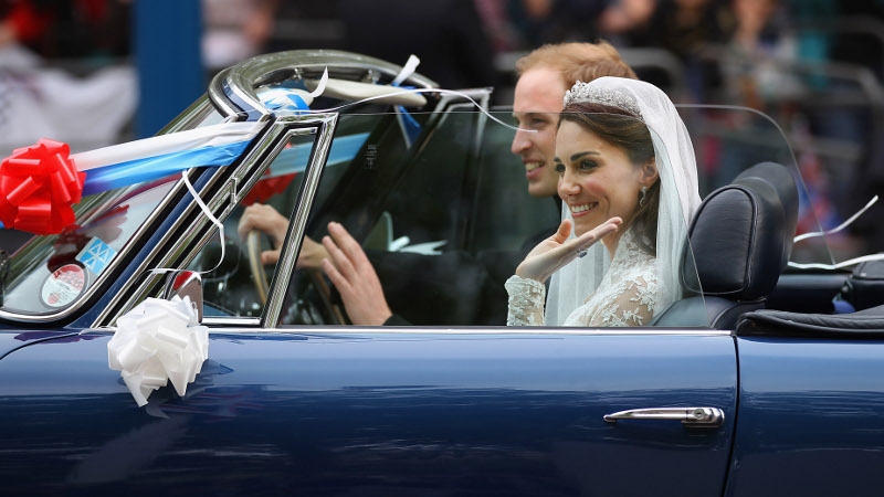 Prince William drives his bride away in a vintage Aston Martin