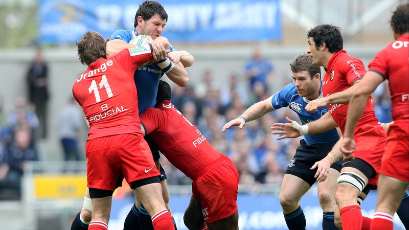 Leinster's Shane Horgan is tackled by Maxime Medard of Toulouse