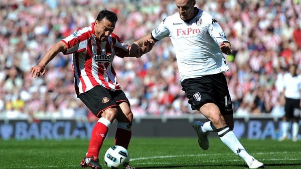 Fulham's Philippe Senderos blocks Sunderland's Steed Malbranque at the Stadium of Light