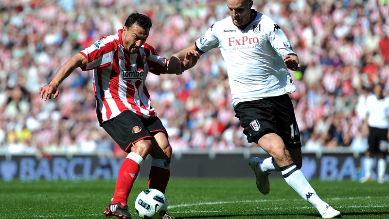Fulham's Philippe Senderos blocks Sunderland's Steed Malbranque at the Stadium of Light