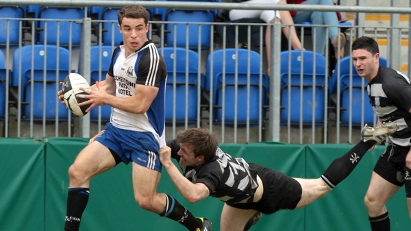 Sean Scanlon (l) scored Cork Con's only try in Donnybrook, but a two-try Man of the Match salvo from John Kennedy (pictured tackling) pushed Belvo to victory