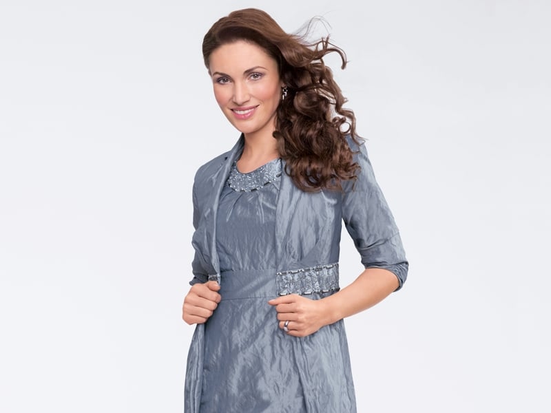 This enchanting blue dress and coat combination is both stylish and luxurious. From Vera Mont.