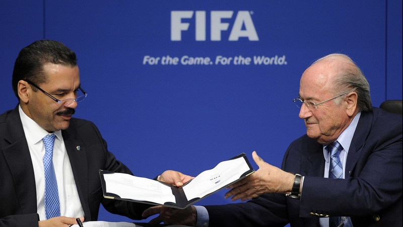Interpol's Ronald Noble and FIFA President Sepp Blatter - signing the landmark agreement