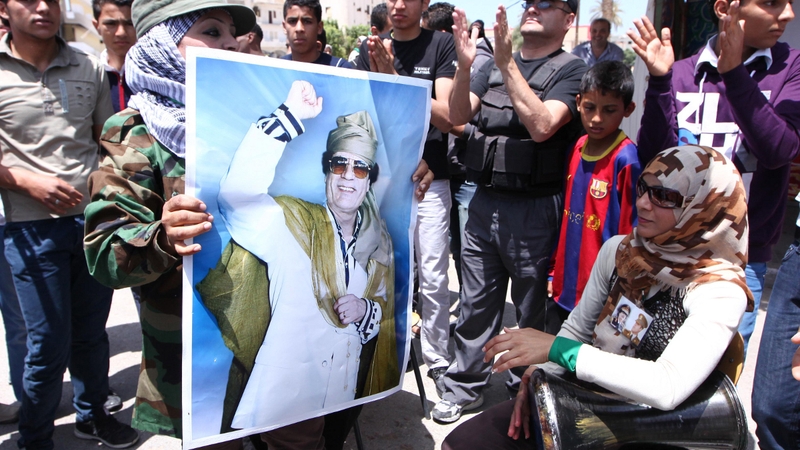 Libya - Supporters of Gaddafi hold up his portrait in the Libyan town of Zawiya