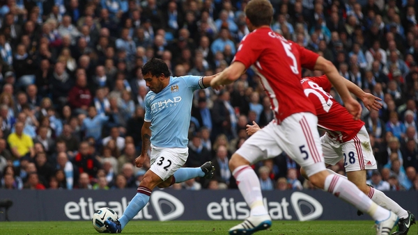 Carlos Tevez - scoring the opening goal in Manchester City's 3-0 victory over Stoke City