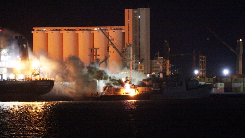 Libya - A ship is engulfed in flames in the port of Tripoli