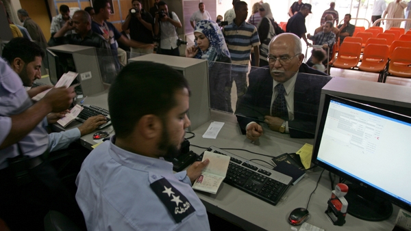 Gaza - Palestinian border police check identity documents of travellers crossing into Egypt